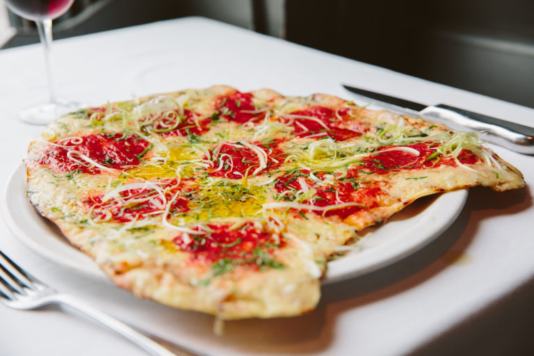 AL FORNO signature dishes Grilled Pizza (Margherita is the classic)Clams Al FornoDirty Steak with Hot Fanny Sauce